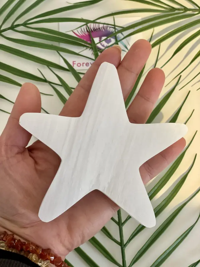 Selenite star, held in the hand