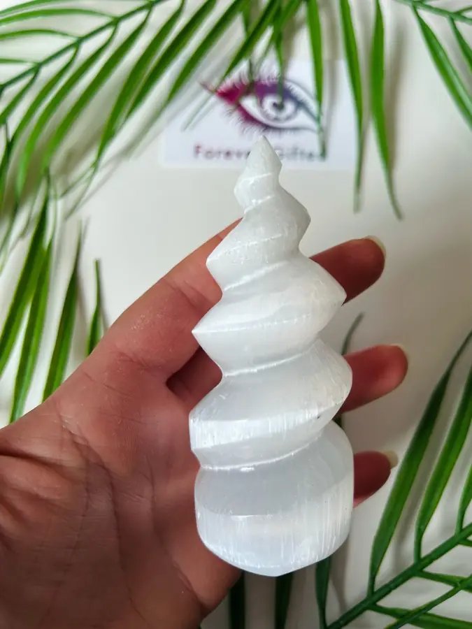 Selenite spiral tower, held in the hand