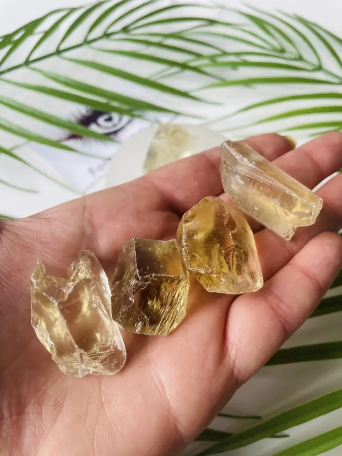 Natural citrine chunks, held in the hand